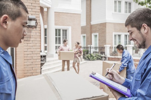 House movers helping a family move in Temple