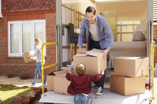 Removal team loading household furniture for a home move in Temple