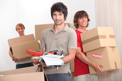 Careful wrapping and labelling items for relocation