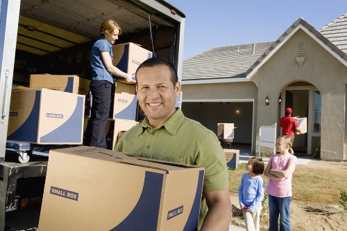 Office furniture and equipment being prepared for a business move